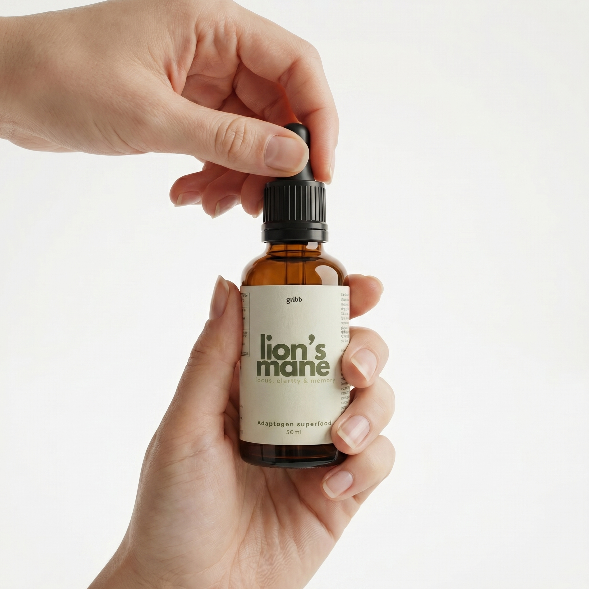 Hand holding a bottle of 'lion's mane' supplement with a plain background